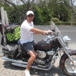 Man on Bike with Tennis Balls