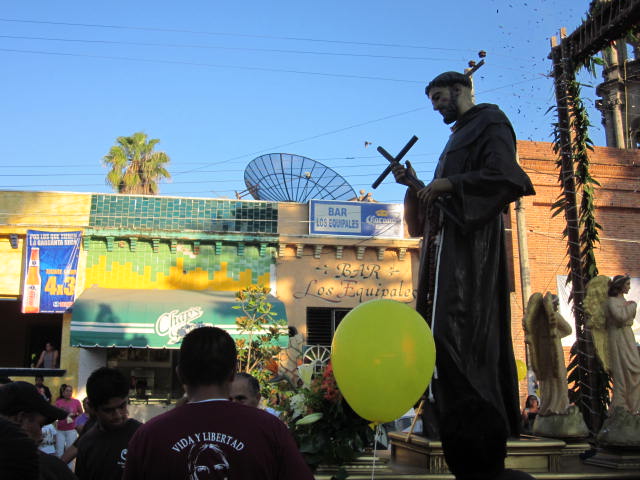 Statue of St. Francis Being Carried by Crowd