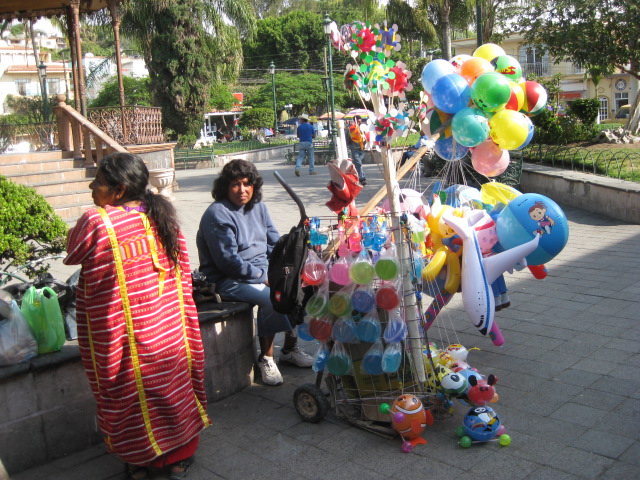 Women Setting up Balloon Stand in Chapala Plaza