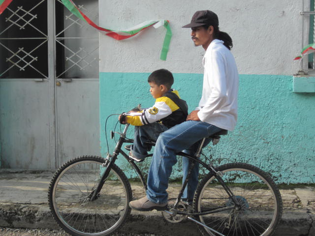 Man and Son on Bicycle