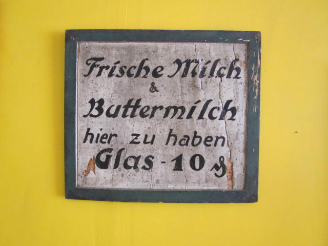 Sign on the Wall That Says Milk and Buttermilk in German