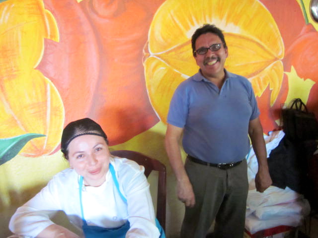 Sylvia, the main cook on the left. Jorge on the right
