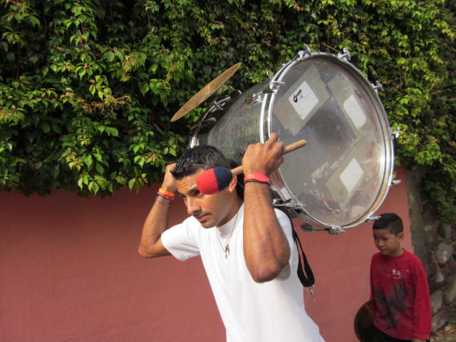 Man Carrying a Drum