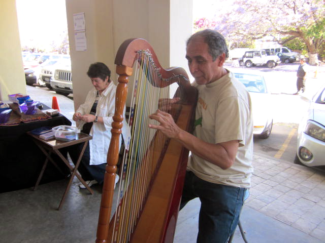 Ignacio, playing his harp