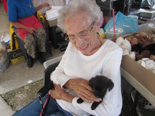 Woman Holding a Puppy
