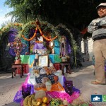 Man Standing by Day of the dead altar in Ajijic Mexico