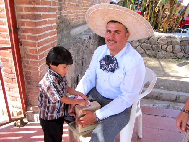 Boy hBoy helping his father with tickets
