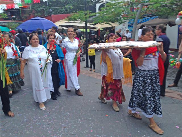 Women Parading with Bread