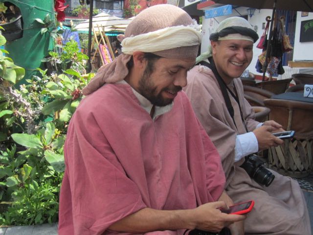 Men on their cell phones