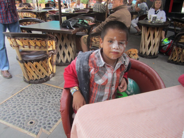 Boy with flour on his face