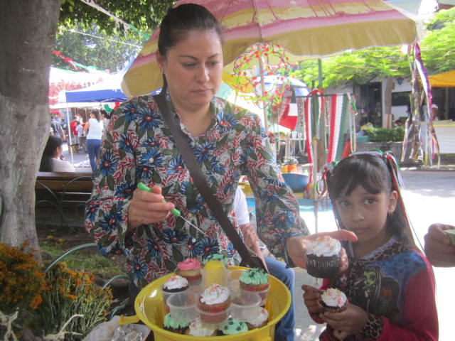 Woman selling cupcakes