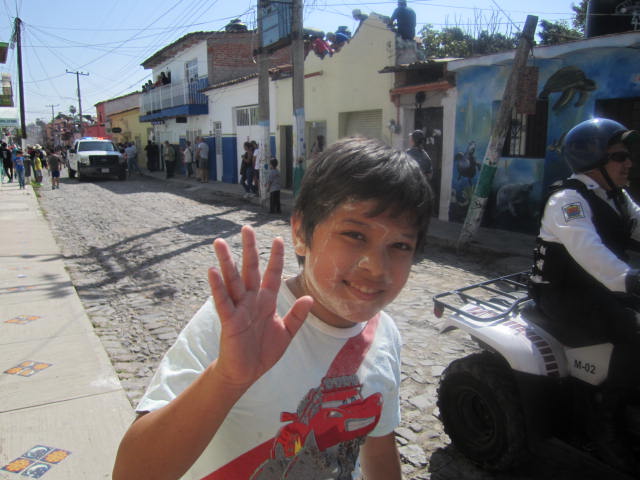 Boy waving