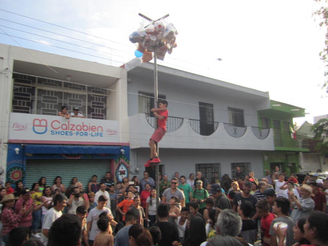 Boys climbing pole