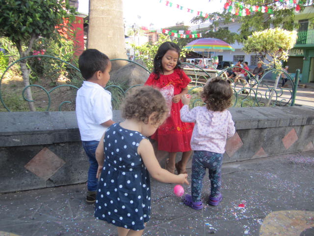 Children cracking eggs